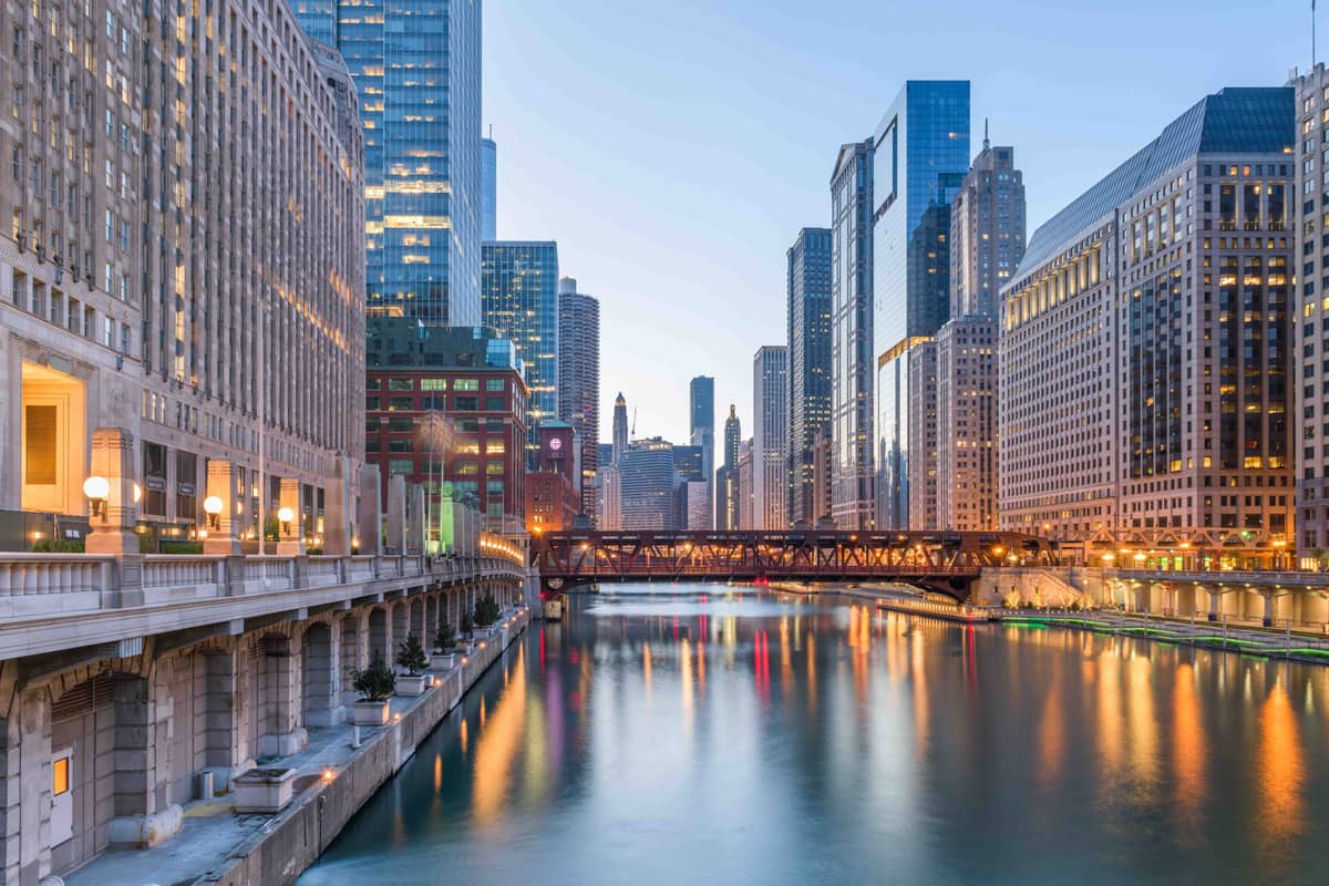 The Chicago River at dusk winding through the downtown Loop skyscrapers in Chicago, Illinois